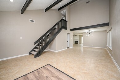 This is a spacious interior with high ceilings, fe