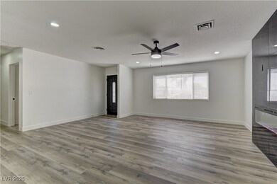Unfurnished living room featuring light wood-type