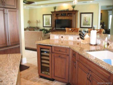 Kitchen features wine cooler, view toward Great Ro