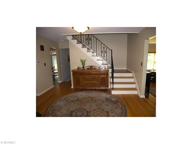 The foyer leads to the living room and dining room
