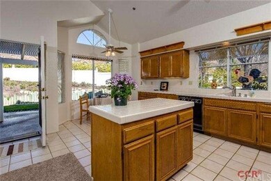 Bright and cheery, this spacious kitchen has a cha