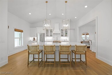 Kitchen featuring premium range hood, a spacious i