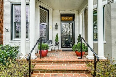 Columned front porch overlooks Meadow Park
