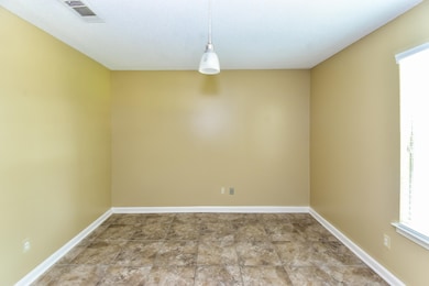 Spare room with baseboards