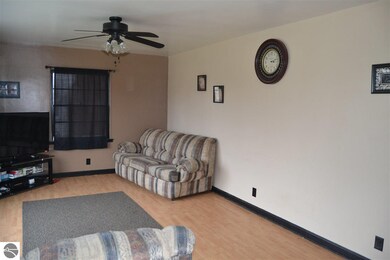 Living room has warm and neutral colors to complim
