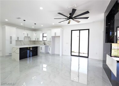 Kitchen featuring a ceiling fan, recessed lighting