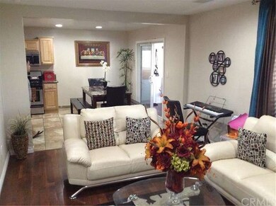 LIVING ROOM OPEN TO DINING AREA