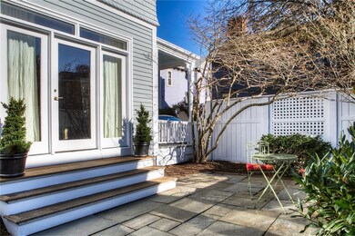 Private patio on side of house leading out from li
