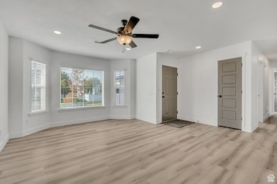 Unfurnished living room with recessed lighting, light wood-type flooring, and a ceiling fan