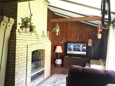 FAMILY ROOM - Wood burning brick fireplace to curl