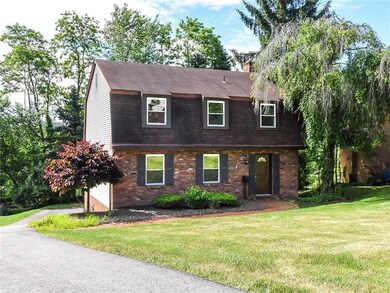 Exterior Front. Long driveway w/  parking pad in r