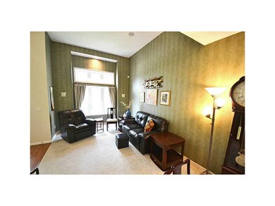 Living Room-L1. The 18  ceiling extends into the s