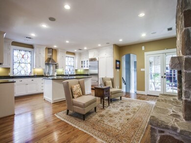 Kitchen opens to den with french doors to outdoor 
