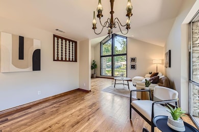 Sitting room with hardwood / wood-style flooring,