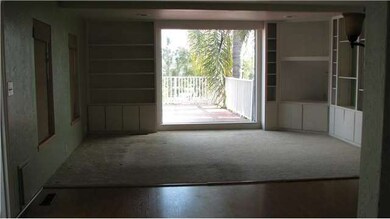 Living room with huge picture window and lots of b