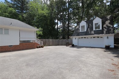 View of side of property featuring a garage