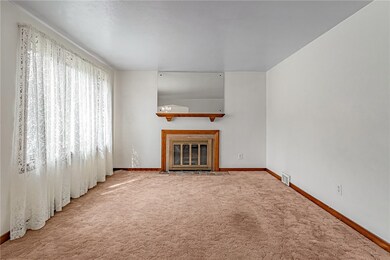 Living room features a functional wood burning fir