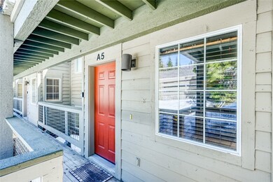 Doorway to property with covered porch