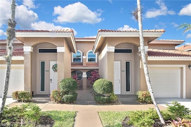 View of front of house featuring concrete driveway