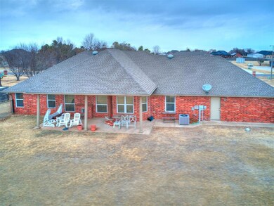 Back of house featuring a patio and central AC