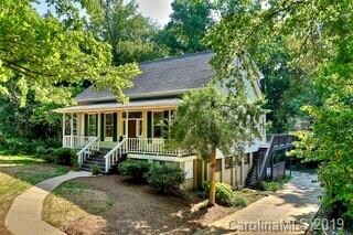 Driveway leads to rear-entry garage and basement l