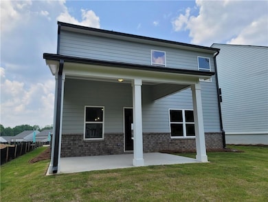 Rear view of house featuring a patio