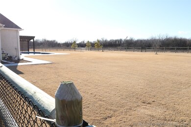 View from driveway side across back yard