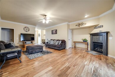 Large living room with gas fireplace and hardwood floors!