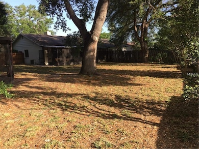 LARGE BACK YARD. OVERLOOKS HUGE SCREENED PORCH. SHED IS TO THE LEFT