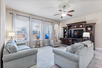 Living area featuring light tile patterned floors