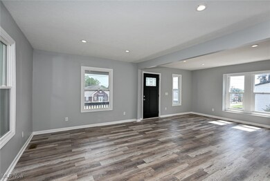 Foyer featuring wood finished floors and recessed lighting