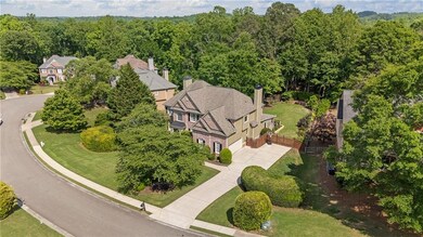 Beautifully maintained exterior with updated lighting, newer garage door, and lush landscaping—every detail designed to impress from the moment you arrive.
