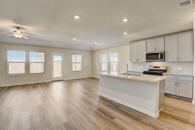 Kitchen with appliances with stainless steel finis