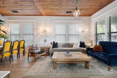 Living room with wooden ceiling and wood finished