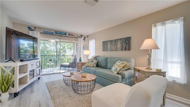 Living area with slider to screened lanai