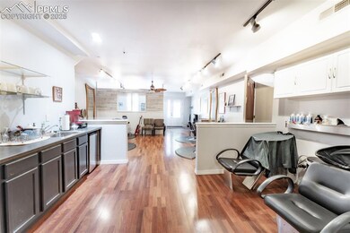 Kitchen with a ceiling fan, open shelves, a sink, 