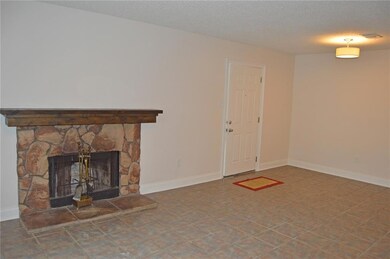 Spacious living area with wood burning fireplace