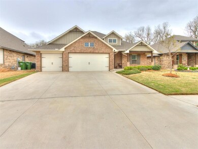 Craftsman-style home with concrete driveway, an at