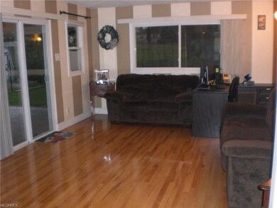THE FAMILY ROOM ADDITION FLOWS NICELY OFF THE LIVING AND DINING ROOMS WITH SLIDERS THAT LEAD TO THE PATIO.