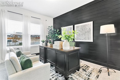 Office area with wooden walls