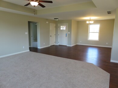 Living room to front entry/dining room view