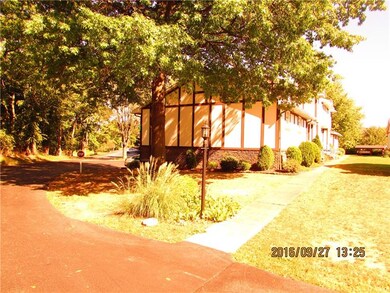 View of side yard with garage access to the left.
