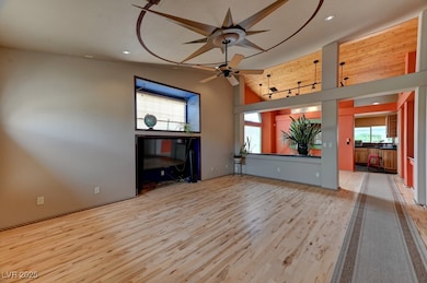 Unfurnished living room with wood finished floors,