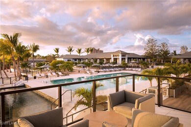 Pool at dusk featuring outdoor lounge area and a p