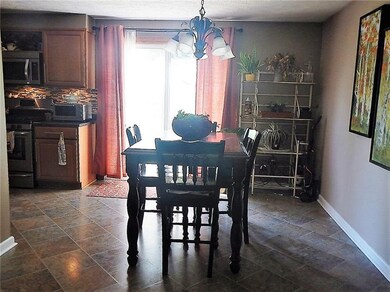 The dining area opens to the kitchen.  The sliding