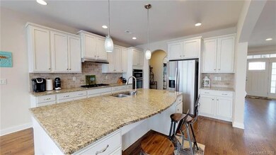 Oversized kitchen island with double stainless ste