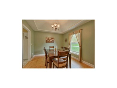 Formal dining room with vaulted ceiling and new li