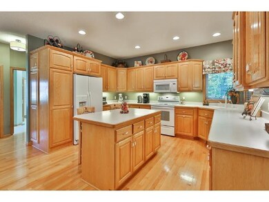 Open concept kitchen design with oak woodwork and 