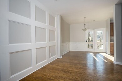 Unfurnished dining area featuring dark wood-style 