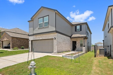 View of front of property featuring an attached g